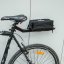 Carrier for bag batteries under saddle