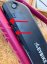 Rubber spacer pad under frame battery holder